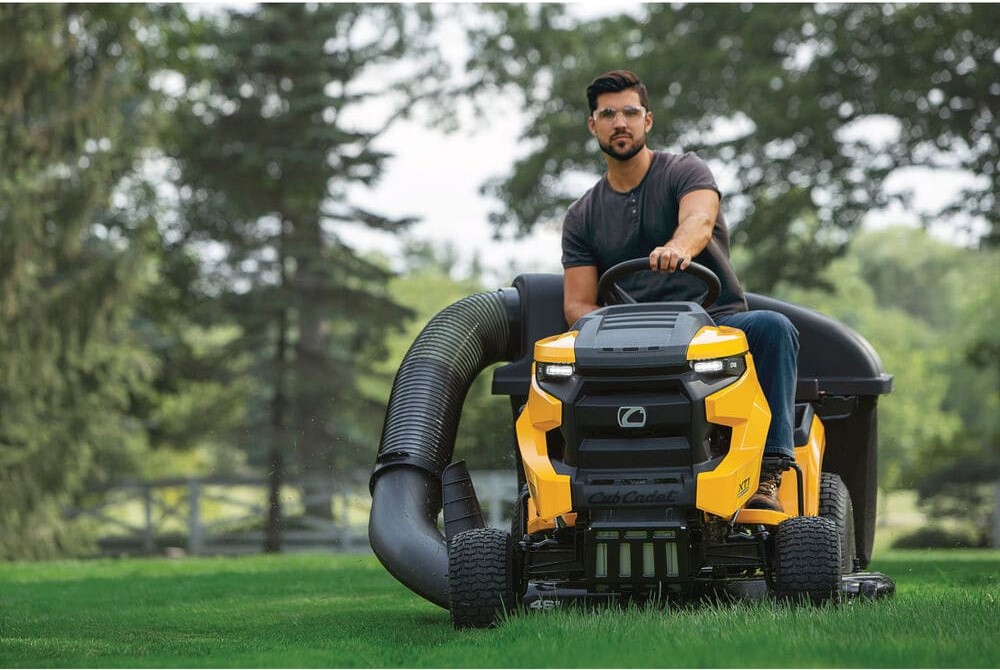 In Greenville, NY, a man operates a striking yellow and black lawn mower, the 2025 Cub Cadet® XT1 Enduro Series XT1 LT46.