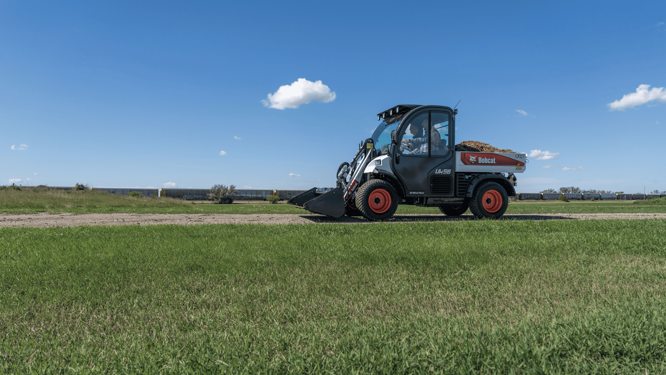  In Greenville, NY, a man expertly maneuvers a black and red Bobcat® ZT6100 Zero-Turn Mower, highlighting its efficiency and style.